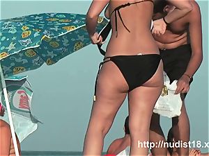 bare beach spycam movie of sizzling playful nudists in water